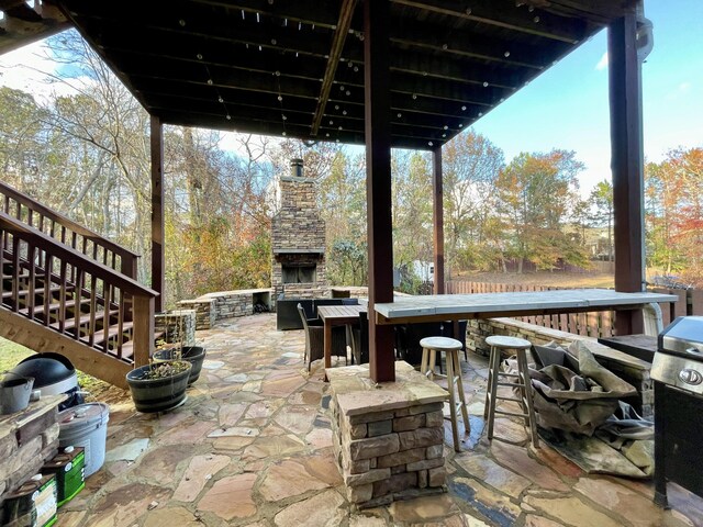 view of patio / terrace with an outdoor stone fireplace