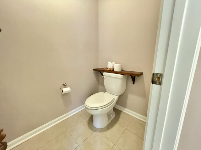 bathroom featuring tile patterned floors and toilet