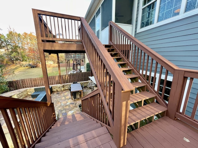 wooden terrace featuring a patio