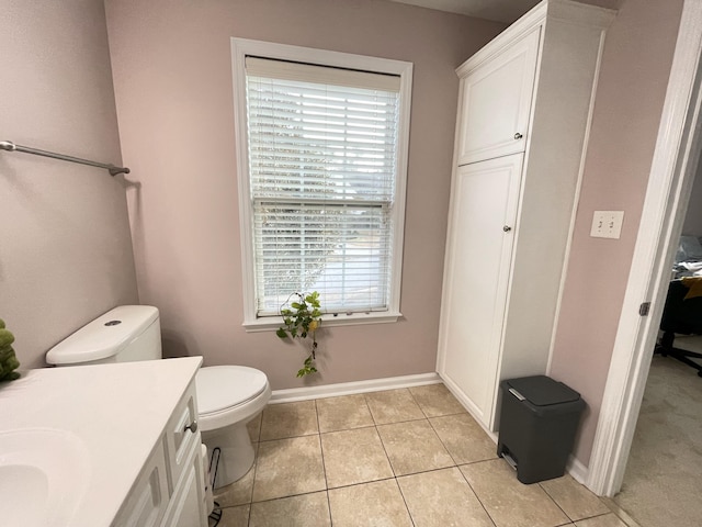 bathroom with tile patterned floors, vanity, and toilet