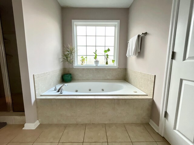 bathroom featuring shower with separate bathtub and tile patterned floors