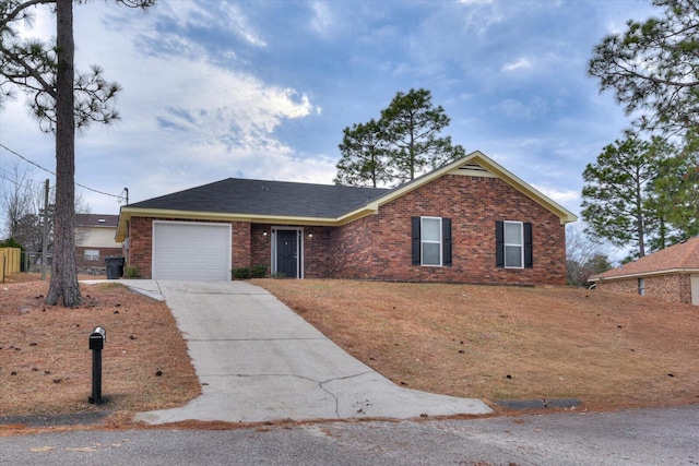 ranch-style house with a garage, brick siding, and driveway