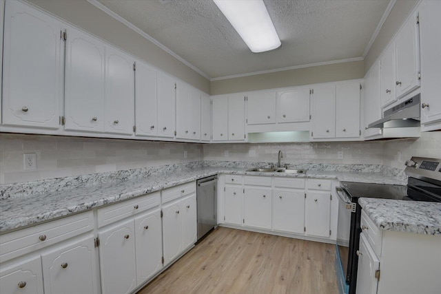 kitchen featuring white cabinets, a sink, appliances with stainless steel finishes, light wood-style floors, and under cabinet range hood