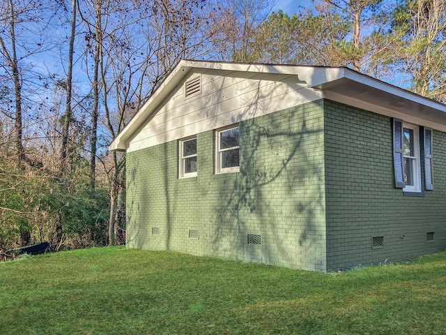 view of property exterior with a yard