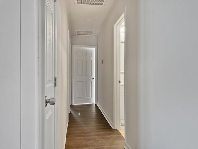 hall with hardwood / wood-style floors