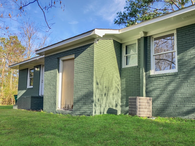 view of property exterior featuring a lawn