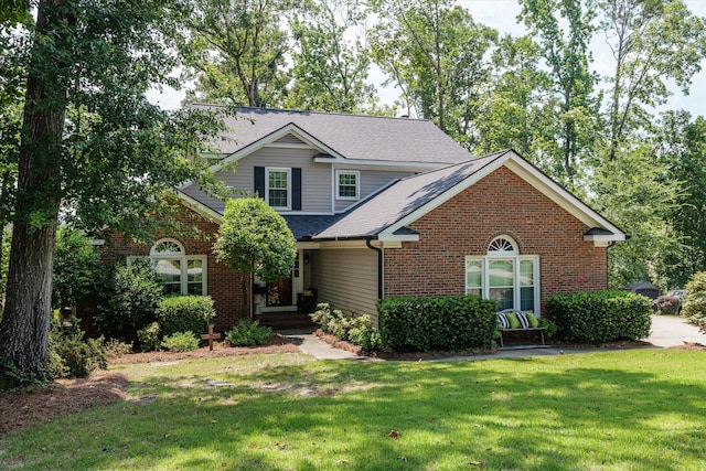 429 Cambridge Cir, Martinez, GA 30907 - traditional-style house with brick siding, a front lawn, and roof with shingles