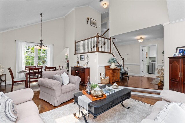 429 Cambridge Cir, Martinez, GA 30907 - living area with stairway, high vaulted ceiling, a chandelier, wood finished floors, and ornamental molding