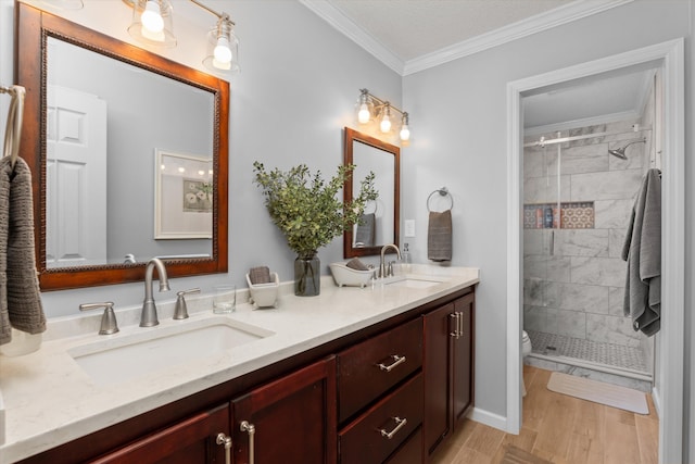 429 Cambridge Cir, Martinez, GA 30907 - full bathroom with double vanity, ornamental molding, a shower stall, and wood finished floors