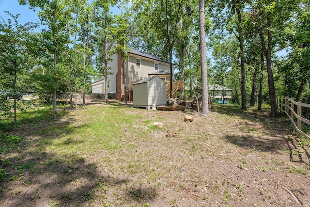 429 Cambridge Cir, Martinez, GA 30907 - view of yard featuring a storage unit and view of wooded area