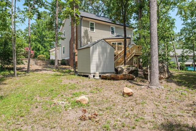 429 Cambridge Cir, Martinez, GA 30907 - rear view of house featuring stairs, a wooden deck, a shed, and a yard