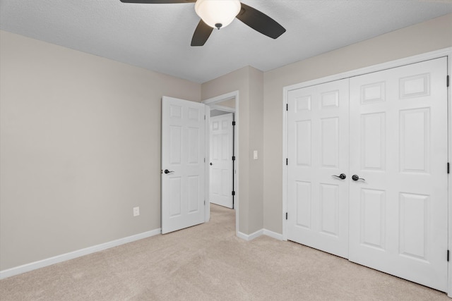 429 Cambridge Cir, Martinez, GA 30907 - unfurnished bedroom with light colored carpet, a closet, ceiling fan, and a textured ceiling