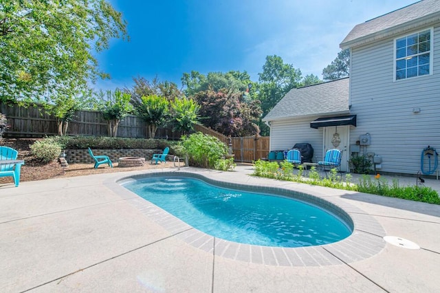 189 Mokateen Ave, North Augusta, SC 29841 - view of swimming pool featuring an outdoor fire pit, a patio area, and a fenced backyard