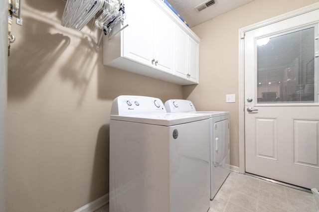 189 Mokateen Ave, North Augusta, SC 29841 - laundry room featuring washing machine and dryer, cabinet space, and light tile patterned flooring