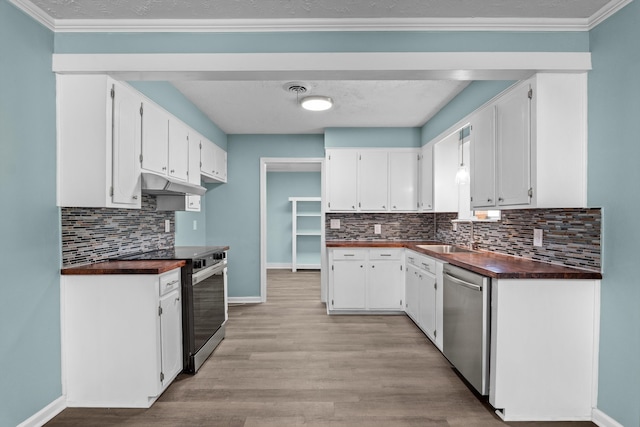 3007 Tallwood Way, Augusta, GA 30906 - kitchen with stainless steel appliances, under cabinet range hood, white cabinets, decorative backsplash, and light wood-style floors