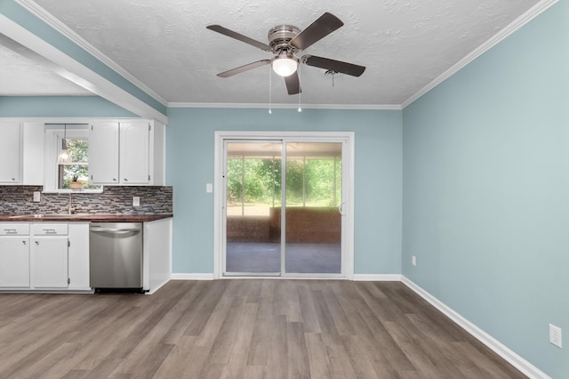 3007 Tallwood Way, Augusta, GA 30906 - kitchen featuring stainless steel dishwasher, wood finished floors, plenty of natural light, ceiling fan, and a textured ceiling