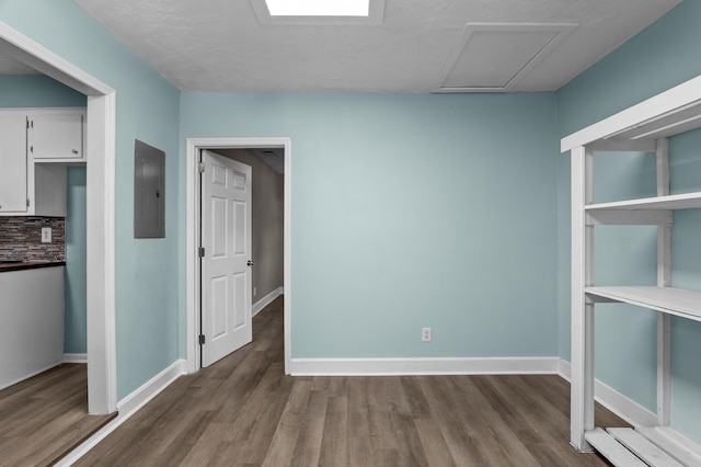 3007 Tallwood Way, Augusta, GA 30906 - spare room with electric panel, wood finished floors, attic access, and a textured ceiling