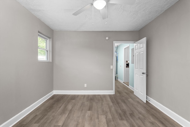 3007 Tallwood Way, Augusta, GA 30906 - unfurnished room with wood finished floors, a textured ceiling, and a ceiling fan