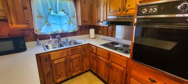 kitchen with black appliances and sink