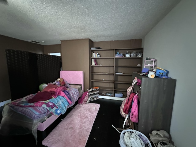 bedroom featuring a textured ceiling