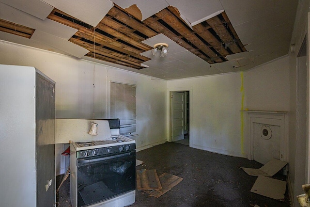 kitchen featuring white range with gas stovetop