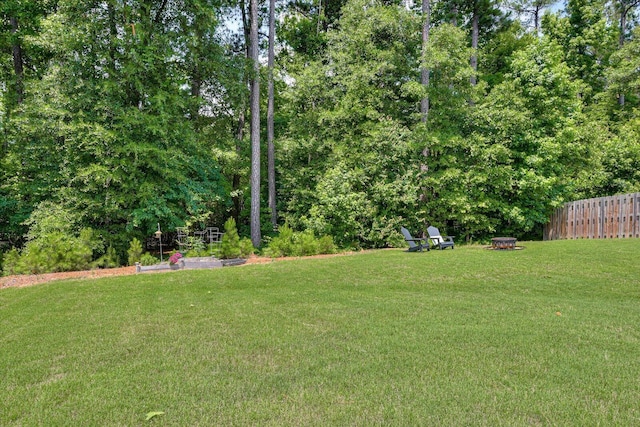 view of yard with an outdoor fire pit