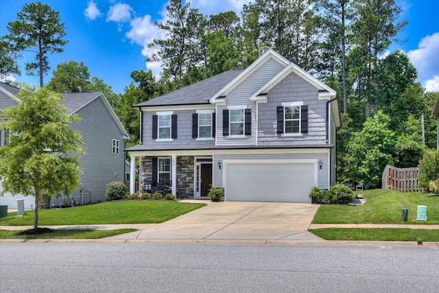 view of front of house featuring a garage and a front yard