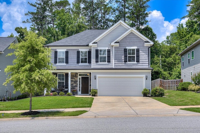 view of front facade featuring a front yard and a garage