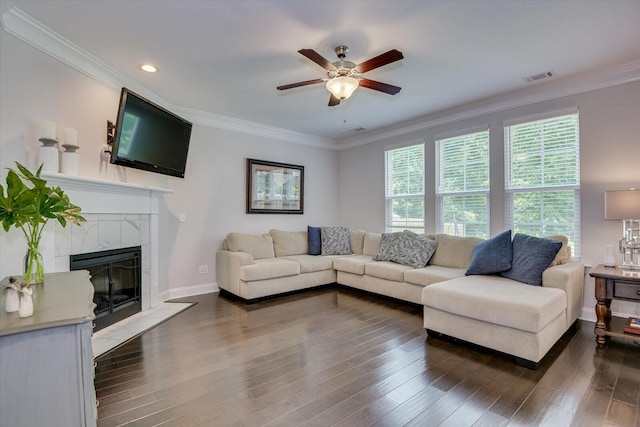 living room featuring a fireplace, dark wood-type flooring, and ornamental molding