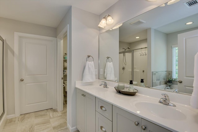 bathroom featuring vanity and shower with separate bathtub