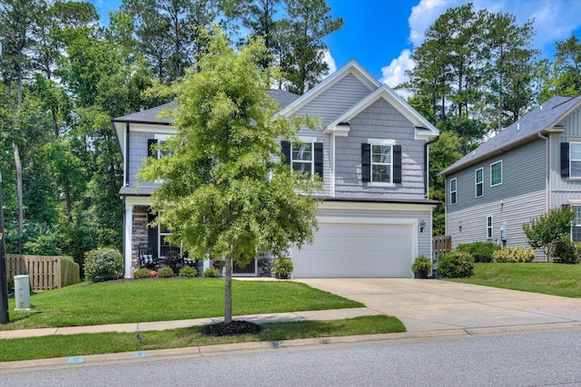 craftsman house featuring a garage and a front lawn