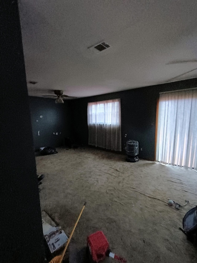 unfurnished room featuring visible vents and a textured ceiling