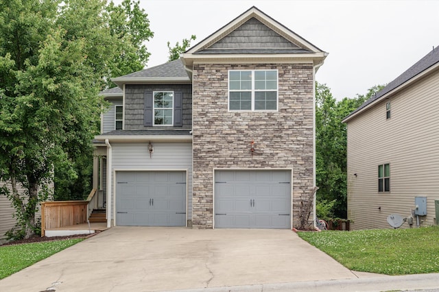 3430 Grove Landing Cir, Grovetown, GA 30813 - view of front of home featuring stone siding, a garage, concrete driveway, and roof with shingles