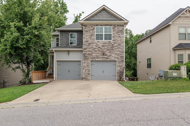 3430 Grove Landing Cir, Grovetown, GA 30813 - view of front of house featuring stone siding, concrete driveway, an attached garage, and a front yard