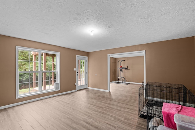 3430 Grove Landing Cir, Grovetown, GA 30813 - living area with baseboards, wood finished floors, and a textured ceiling