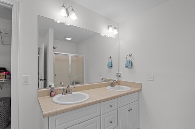 3430 Grove Landing Cir, Grovetown, GA 30813 - bathroom with double vanity, a walk in closet, and a shower stall