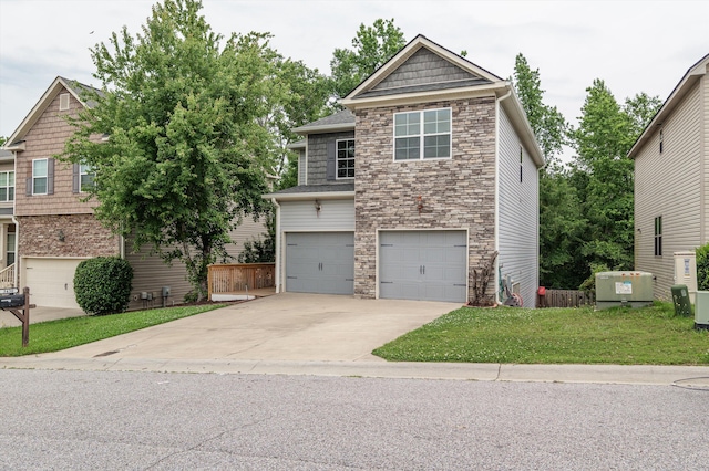 3430 Grove Landing Cir, Grovetown, GA 30813 - view of front facade with stone siding, an attached garage, concrete driveway, and a front lawn