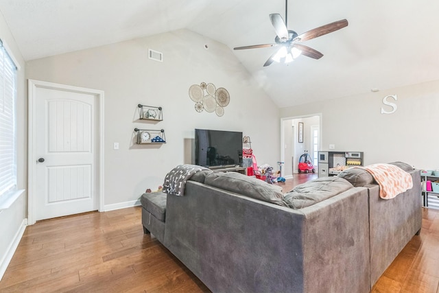 7105 Summerton Dr, Augusta, GA 30909 - living area with light wood-style floors, vaulted ceiling, visible vents, and ceiling fan
