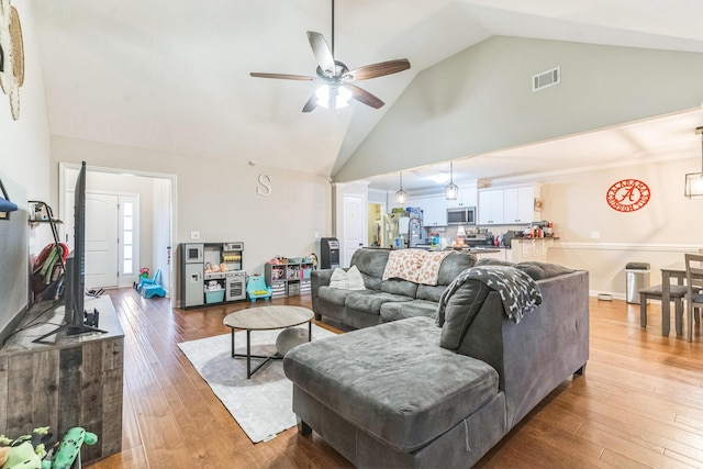 7105 Summerton Dr, Augusta, GA 30909 - living area with visible vents, ceiling fan, high vaulted ceiling, and hardwood / wood-style flooring