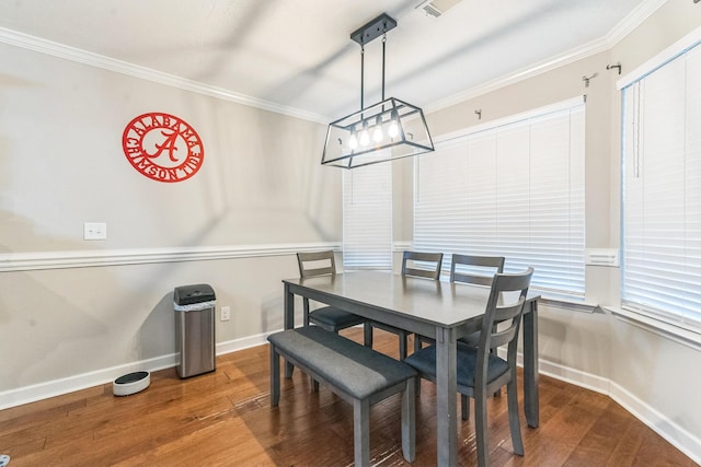 7105 Summerton Dr, Augusta, GA 30909 - dining space featuring crown molding, wood finished floors, and baseboards
