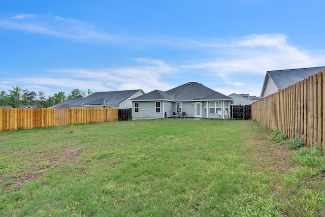 7105 Summerton Dr, Augusta, GA 30909 - rear view of house featuring a fenced backyard and a lawn