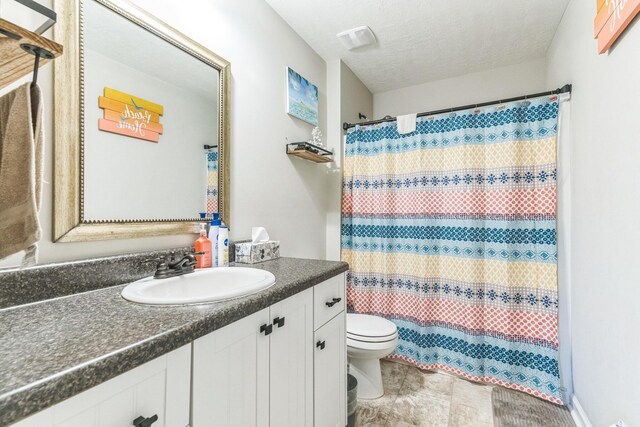 7105 Summerton Dr, Augusta, GA 30909 - bathroom featuring visible vents, a shower with curtain, toilet, a textured ceiling, and vanity