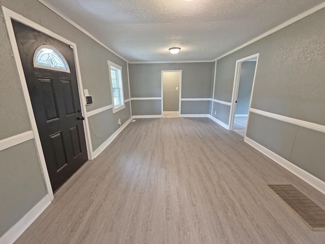 1005 Weston St, North Augusta, SC 29841 - foyer entrance featuring a textured ceiling, wood finished floors, crown molding, and a textured wall
