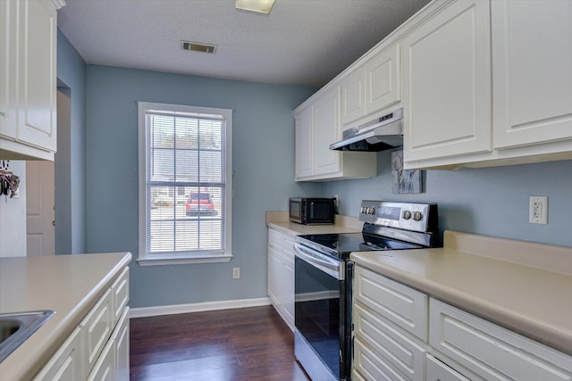 kitchen featuring black microwave, under cabinet range hood, visible vents, white cabinetry, and stainless steel range with electric stovetop