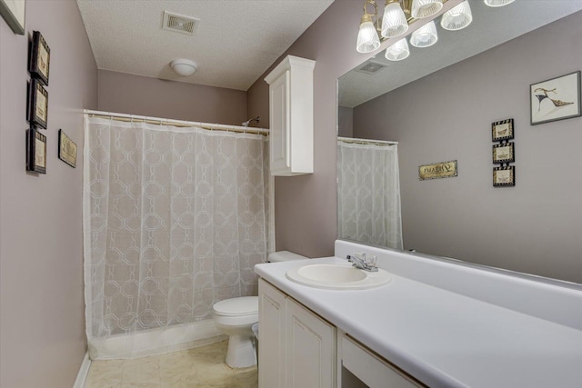 bathroom with toilet, a textured ceiling, vanity, and visible vents