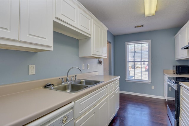 kitchen featuring light countertops, electric range, white cabinetry, a sink, and black microwave