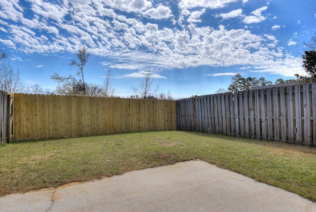 view of yard with a fenced backyard and a patio