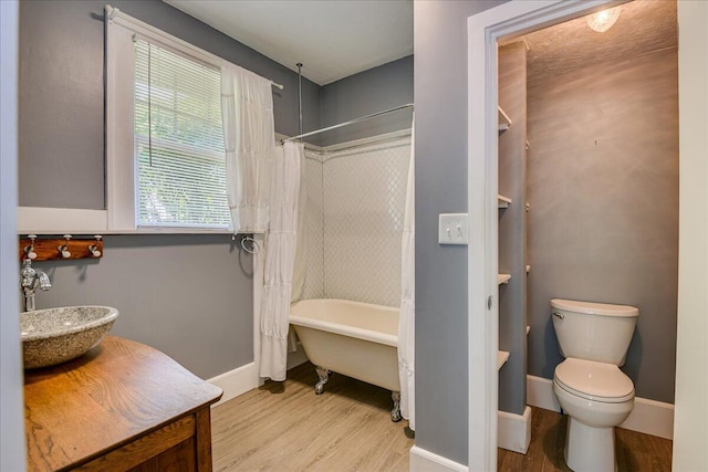 844 Heard Ave, Augusta, GA 30904 - full bathroom with wood finished floors, vanity, and shower / tub combo