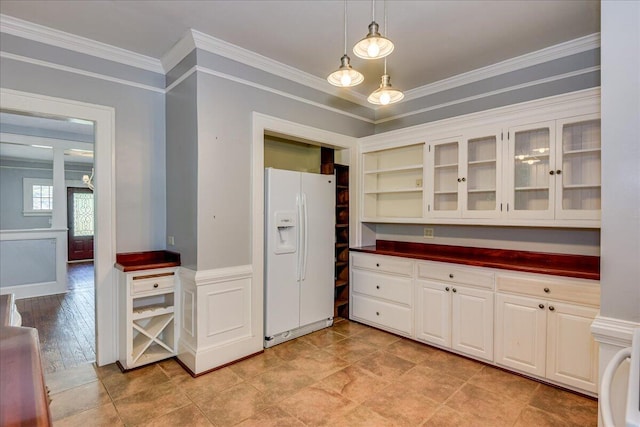 844 Heard Ave, Augusta, GA 30904 - kitchen featuring white fridge with ice dispenser, dark countertops, crown molding, glass insert cabinets, and decorative light fixtures