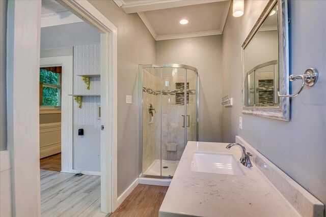 844 Heard Ave, Augusta, GA 30904 - bathroom with a shower stall, ornamental molding, wood finished floors, and vanity